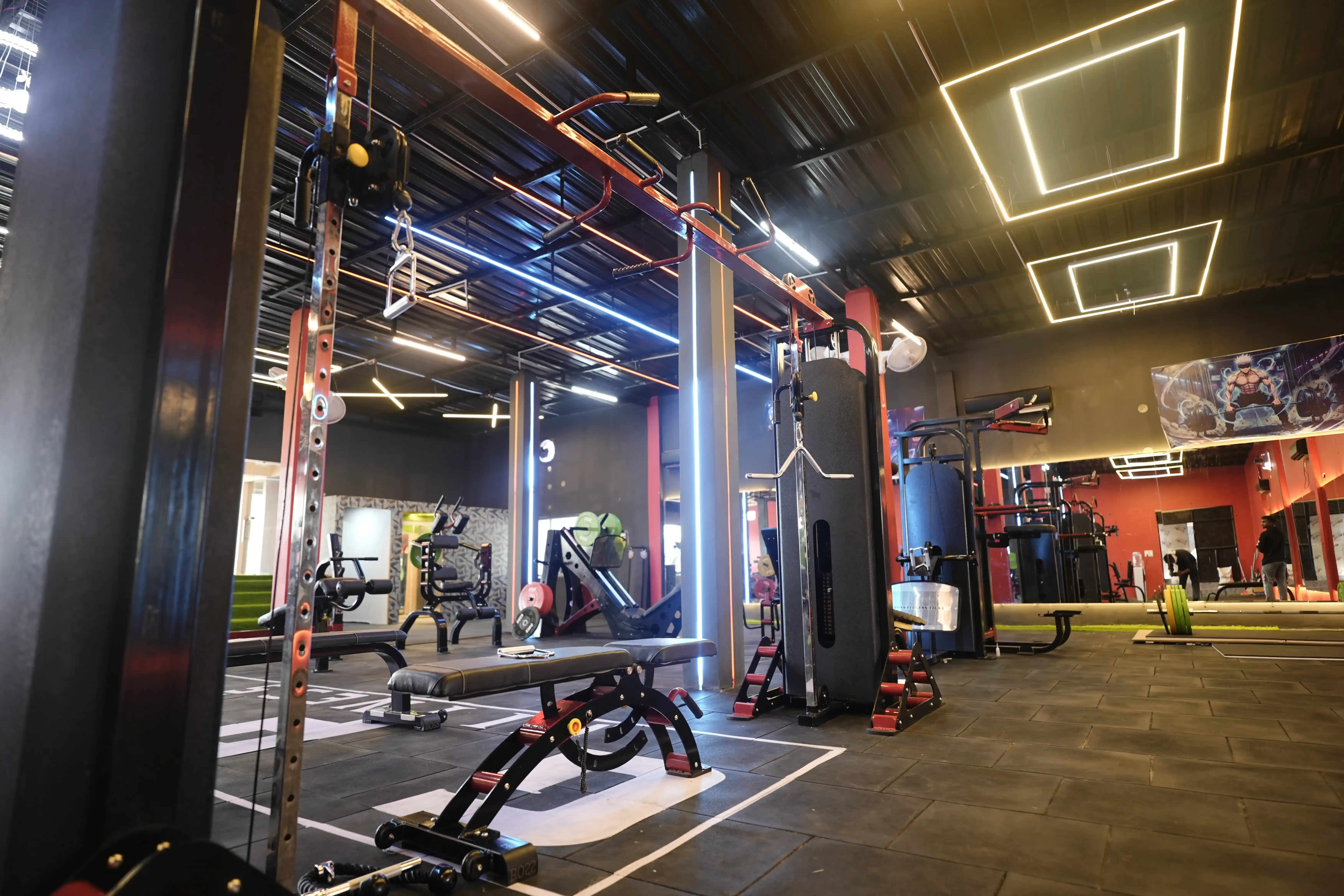 Cable station with benches and strength machines at GPM Fitness