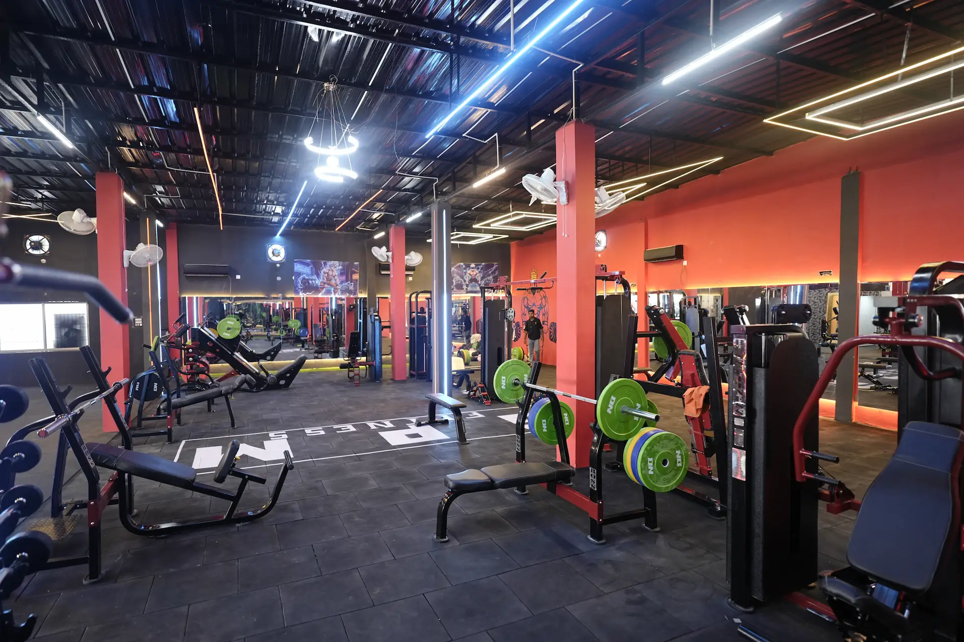 Main strength floor with benches and machines at GPM Fitness