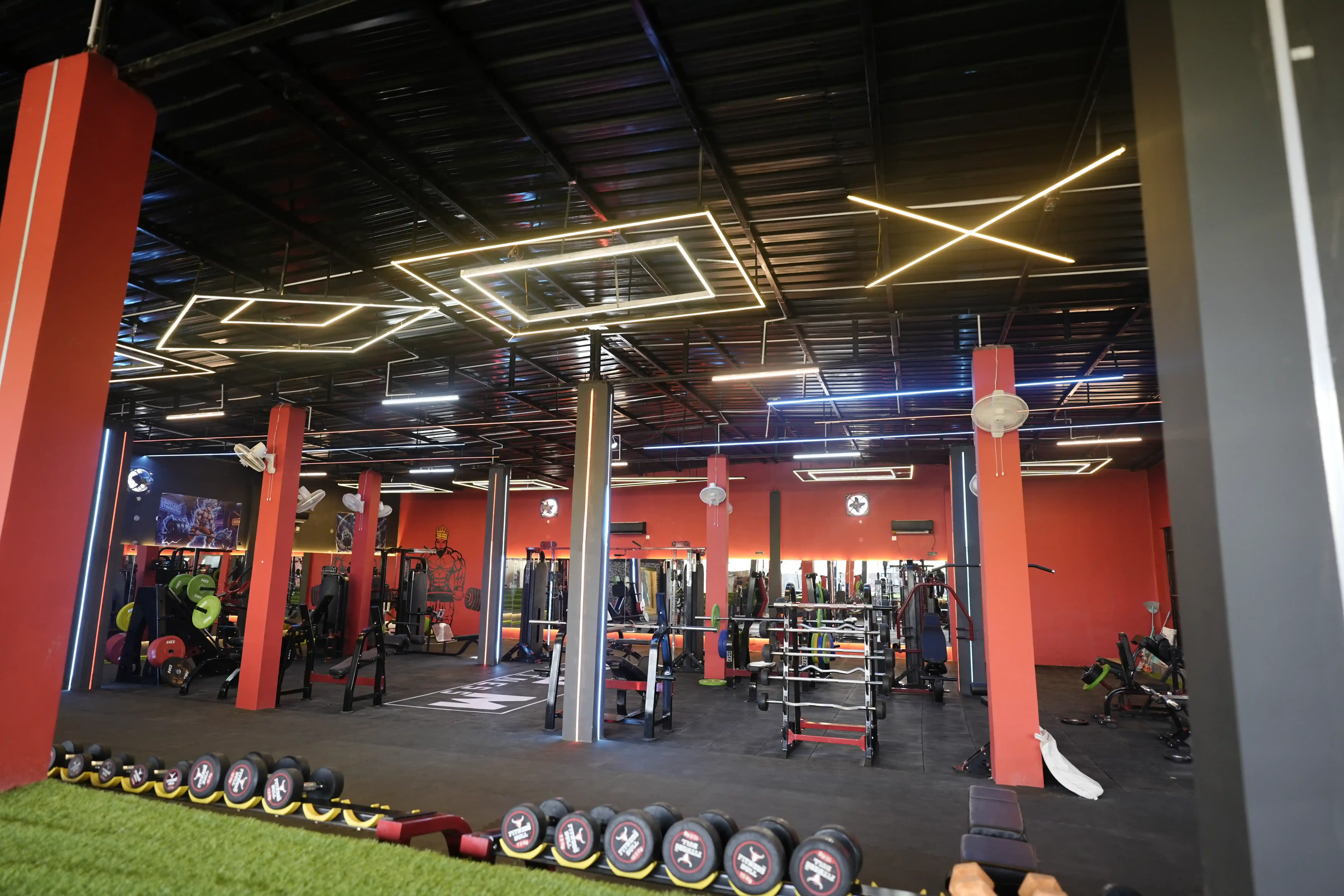 Wide full view of the GPM Fitness strength floor and training machines